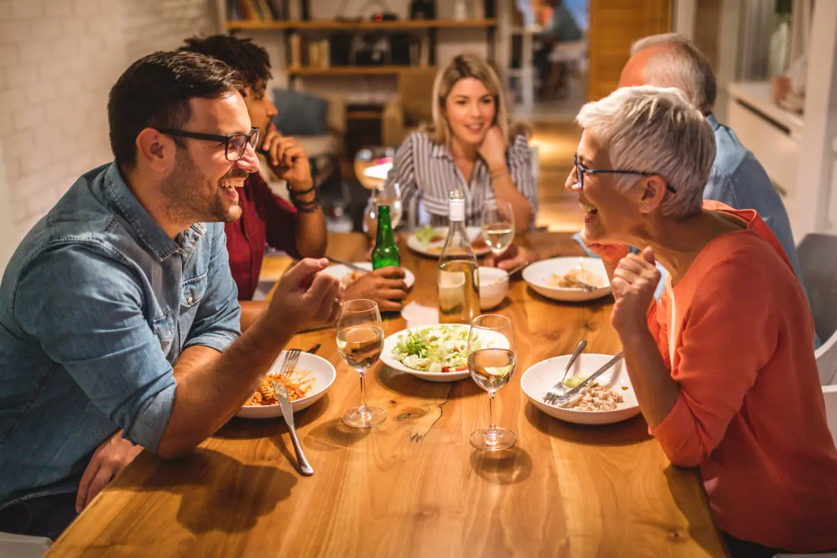 family at dinner table having a lovely time together