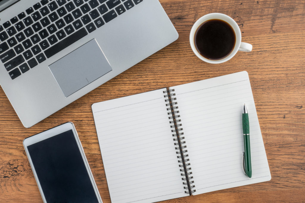 Laptop, notebook, Tablet and coffee on work desk